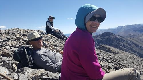 All smiles soaking up the sun during an extended lunch on Tiara Peak 