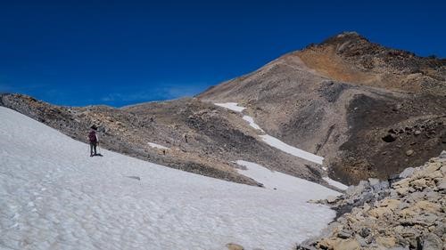Taking advantage of the snow, Waputik Peak on the right.