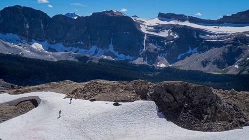 Descending on snow with Mt Bosworth towering above.