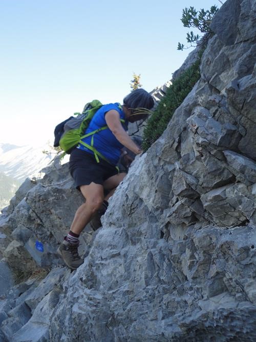 Audrey tip toeing up the crux