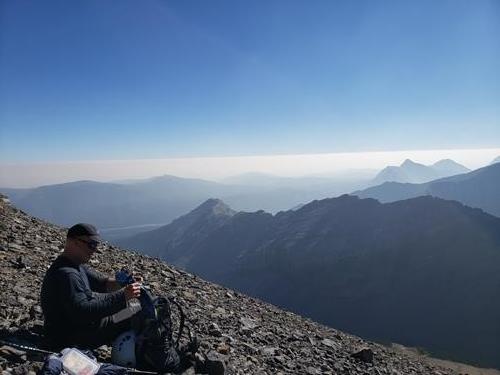 On the way up Mount Glasgow. The horizontal line in the background is the bank of smoke over Calgary