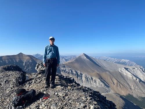 Jack on the summit of Banded Peak, Mount Glasgow and Cornwall in the background