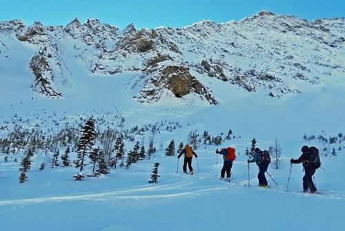 Heading up for a second run below Grizzly Ridge (our first tracks above)