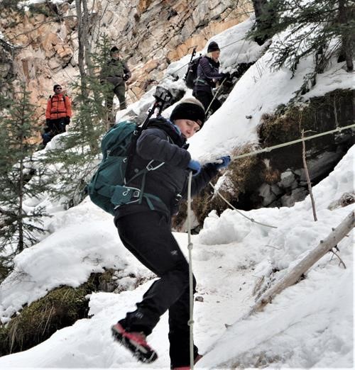 {2454 ch n} descends from the short ledge section by hanging onto a fixed rope enroute to the Green Monster 