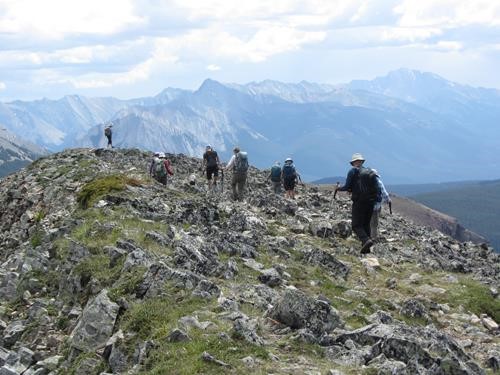 Picking through the summit ridge rocks