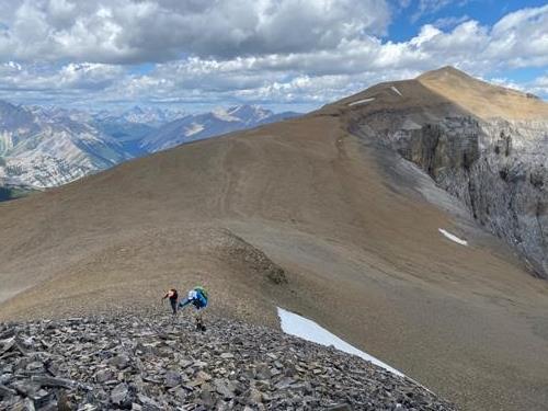 Climbing up Outlaw with Cornwall behind