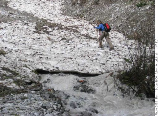 Barbara crossing snow bridge on Old Goat Creek
