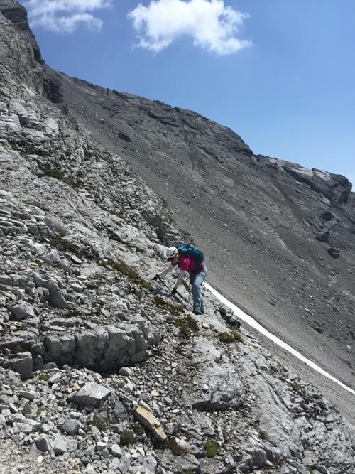 {1947 ca li} at the top of the first cliffband