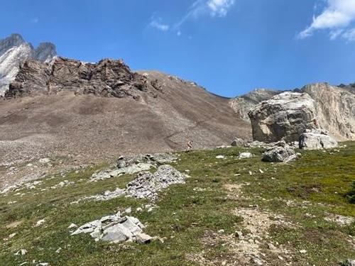 At the big rock before starting the climb to the pass