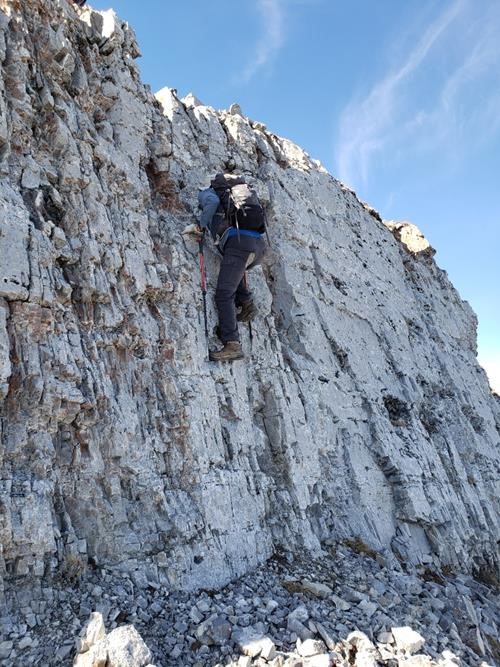 John climbing up the cliff band just below the Centre Peak of Moose Mountain.