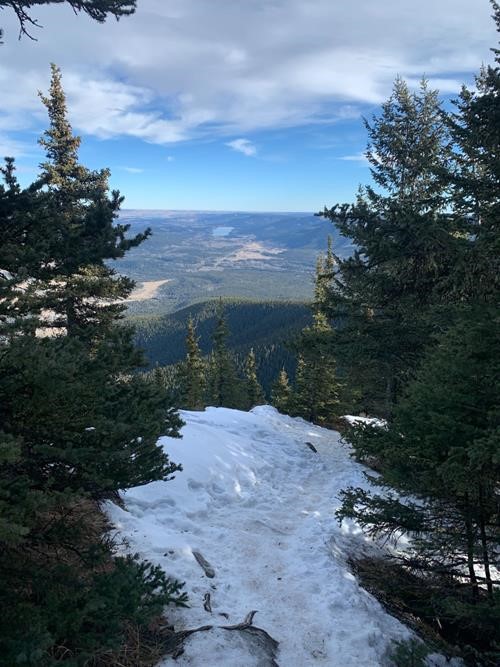 Descending the ice-covered path