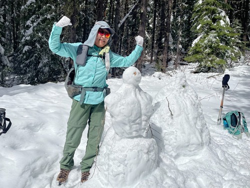 Sim shows the six-pack-ab snowman her superior pecs