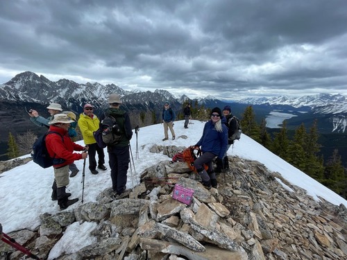 Enjoying the summit under low-hanging clouds. 