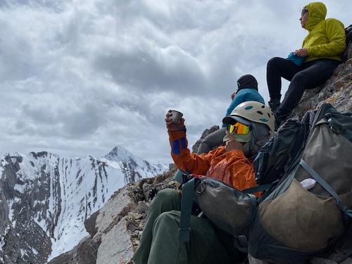 Sim, caught on camera making a toast to yet another summit