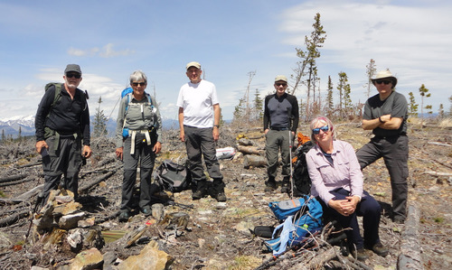 Ramblers on the summit of Lusk Ridge East with geocache