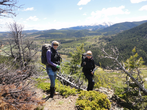 Ramblers pose on Deer Ridge near Sibbald Flats. Moose Mtn in top right