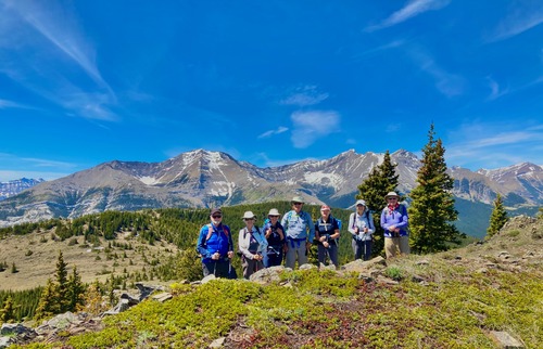 Group at the top of Bull Creek Hills with Mount Holy Cross behind