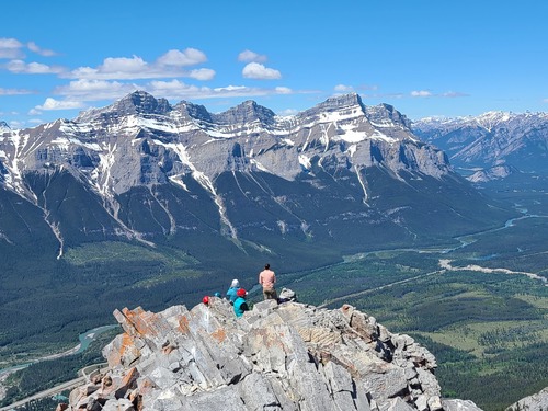 View downward toward the roomier summit (taken by Alda on the true summit)