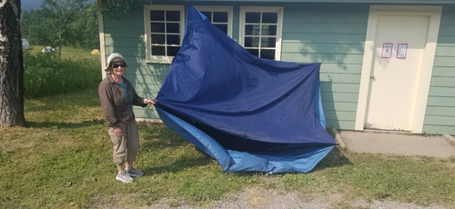 Nancy to the rescue! This 4-man tent with gear inside had to be retreived after becoming airborne and taking off.