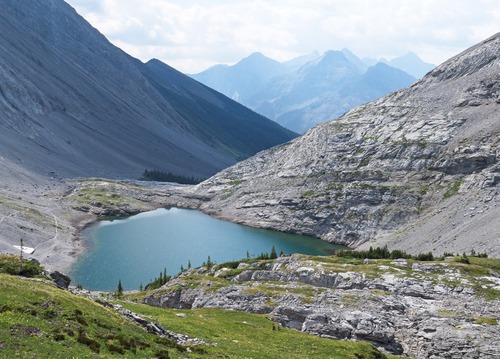 Rather than going back down the steep grovel beside the cascades, we opted to descend a meadowy ramp most of the way to the lower lake., which required an easy creek crossing