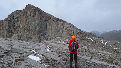 Tatyana pausing to enjoy the rock formations on a broad plateau.