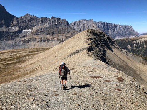 Ingrid backpacking along a ridge high above the Rockwall trail