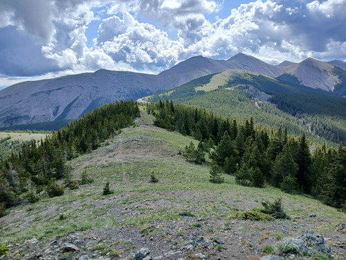Ridge to fourth peak and glimpse of road to wellsite below the peak