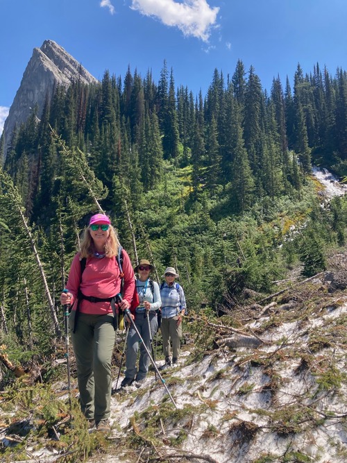 Crossing the remnant avalanche debris below the falls on our return