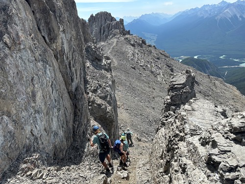 Once down this somewhat loose gully, you can see the easy path toward the centre peak Once down this somewhat loose gully, you can see the easy path toward the centre peak