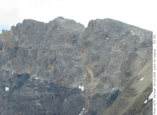 Peter or Yves on the right summit, before the first downclimb.