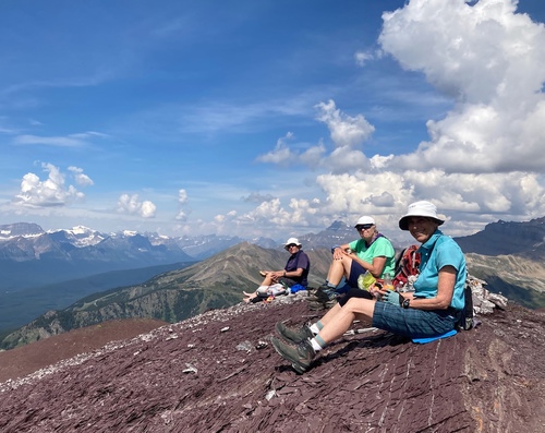 Carl, Teresa and Nardi at the summit of Purple Mound with Mt Balfour in the far left