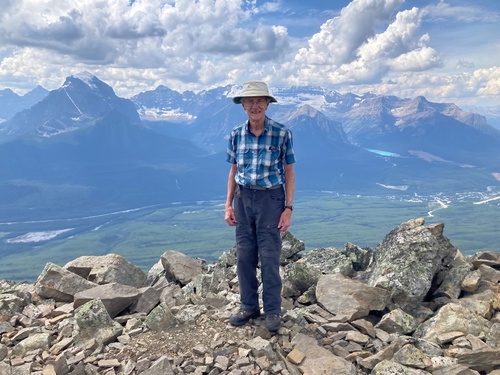 Doug at the summit of Mt Lipalian with Lake Louise and it's 5000 visitors in the background