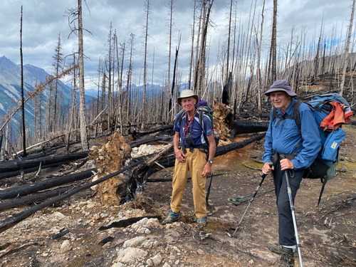 David and Bob pose in the burnt trees on the GDT north of Amiskwi Pass