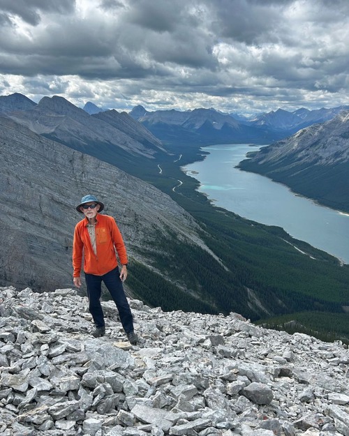 Arnold at the summit of Little Lougheed (Birdwood and Smuts in the distance above his head)
