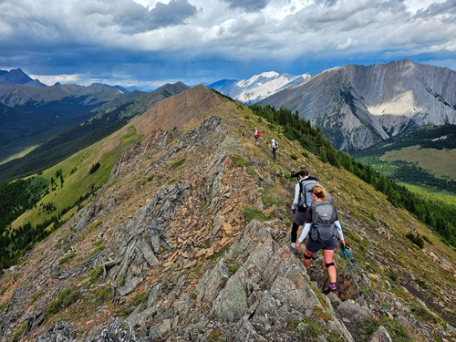 Ridge walk under dark clouds and some sun.