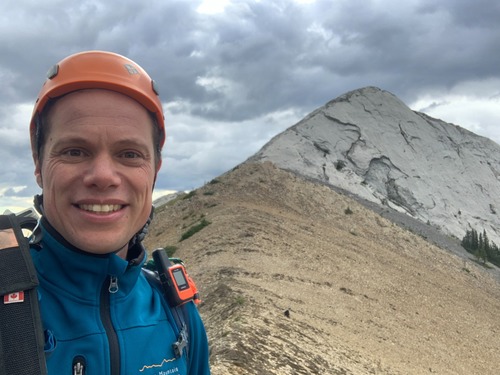 {2201 se la} with Mary Barclay in the background after the traverse.