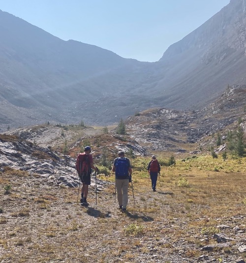 Crossing the meadows towards the rocky climb to the Piggy-Plus Burstall col