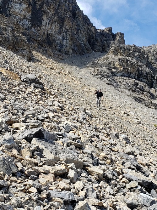 Gary descending the scree slope below the gulley that leads to the summit ridge of Noseeum Peak.