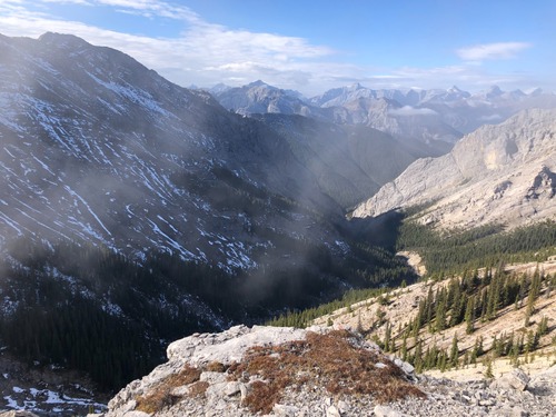View WSW from Boundary ridge, looking down into Porcupine Ck N fork, with Mts Kidd, Bogart and Lougheed group in distance.