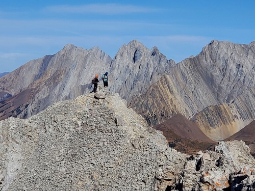 Alda and Matthew pausing to identify the surrounding peaks