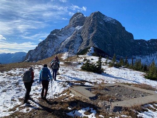 At the old lookout site; heading to a lunch spot right where the snowy/treed slope meets Mt Kidd