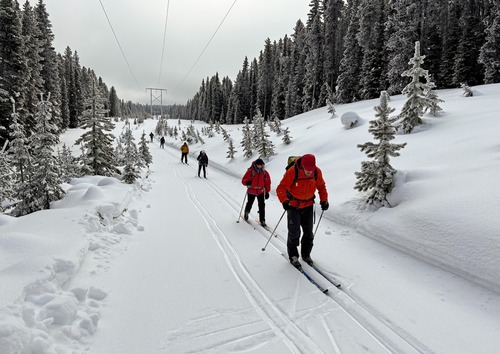 Rime covered trees and a line of puffy jackets