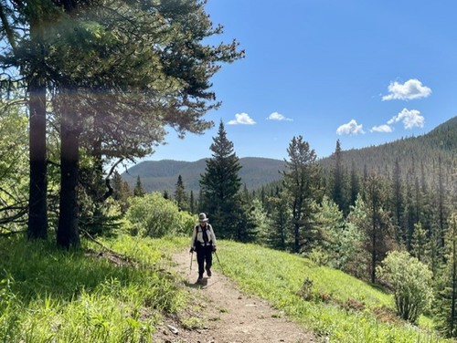 Jeannette hiking along the wide, well-graded trail 