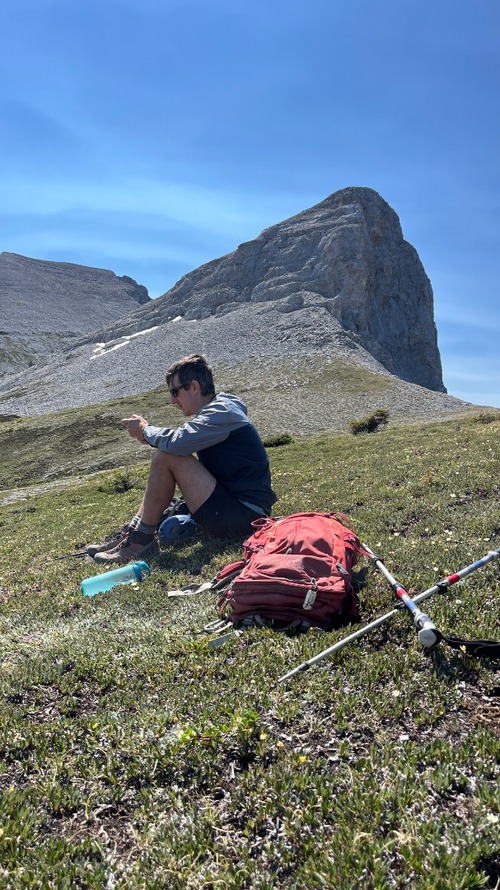 Matthew, with our summit in the background