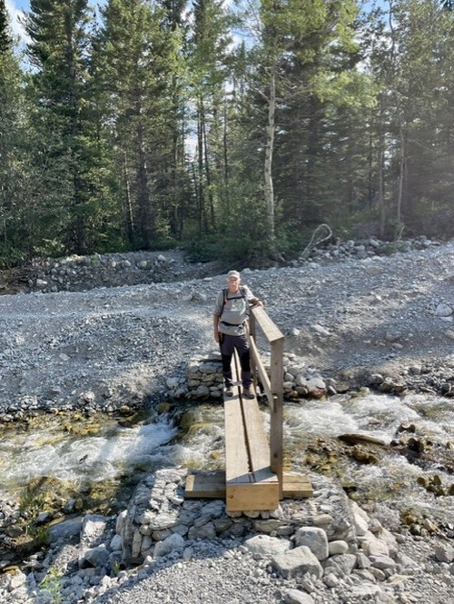 The small but sturdy bridge across the creek