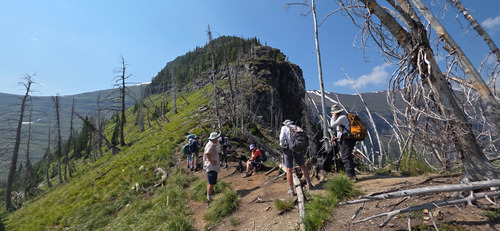 Resting at the col before ascending the scramble section.