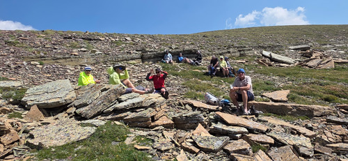 The team hunkered down on the ridge for lunch.