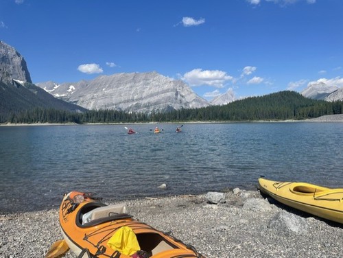 Because of its beauty, Upper Kananaskis Lake attracts paddlers