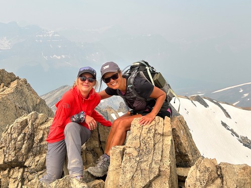 On the summit, ample amount of snow in area. 
