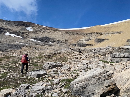 We'll head straight up the orange scree and then traverse above the cliffband